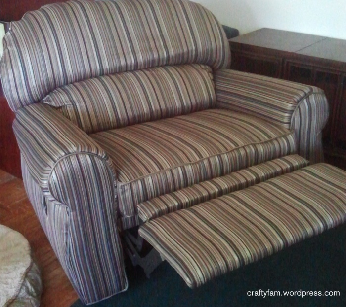 reupholstered over-sized recliner chair