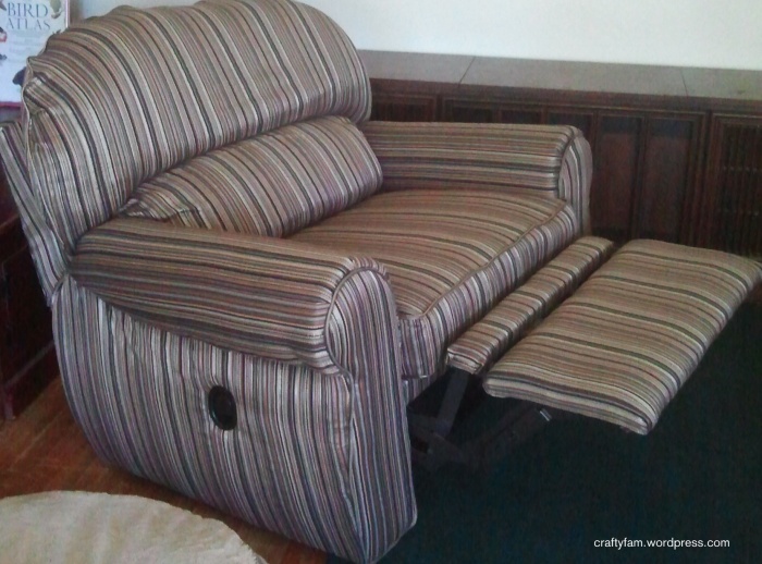 reupholstered over-sized recliner chair